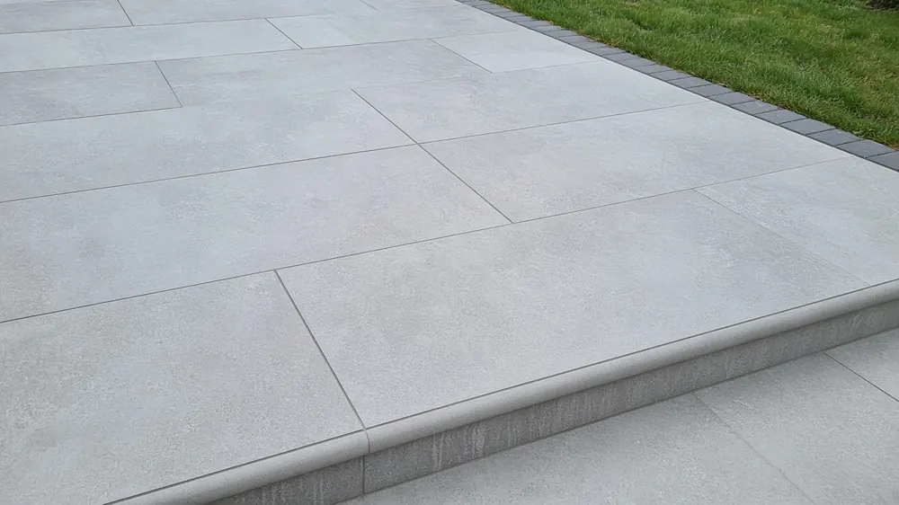 Example image: close-up of grey porcelain slabs with neat, evenly filled joints